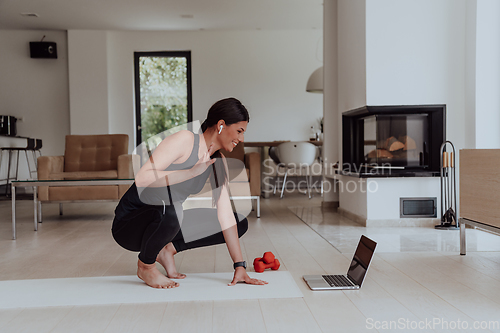 Image of Young Beautiful Female Woman with Trainer via Video Call Conference in Bright Sunny House. Healthy Lifestyle, Wellbeing and Mindfulness Concept.