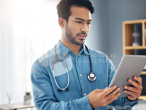 Image of Tablet, serious man and doctor in healthcare office for telehealth, solution and research. Digital technology, unsure or confused medical worker and data analysis for online test results of clinic