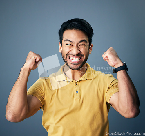 Image of Indian man, excited celebration and studio portrait for winning mindset, happiness or achievement by background. Young model, male student or celebration with happy, fist and winner with motivation