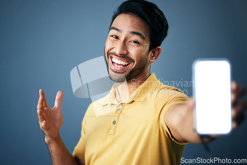 Image of Phone mockup, studio portrait and happy man with online ui for product placement, branding copy space or marketing. Advertising mock up, white screen cellphone and excited person on blue background