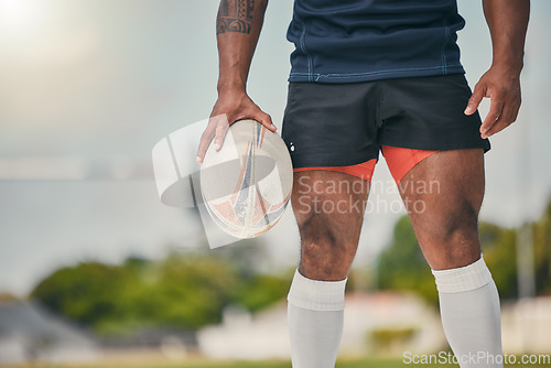 Image of Rugby, man and ball, zoom on legs of strong, muscular male ready at winning game on field. Fitness, sports and professional sport player at practice match, workout or competition on grass at stadium