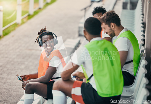 Image of Team, sport and rugby men on break with smile, planning and conversation for diversity, solidarity and happy. Group teamwork, university or professional sports at stadium for fitness, friends or goal