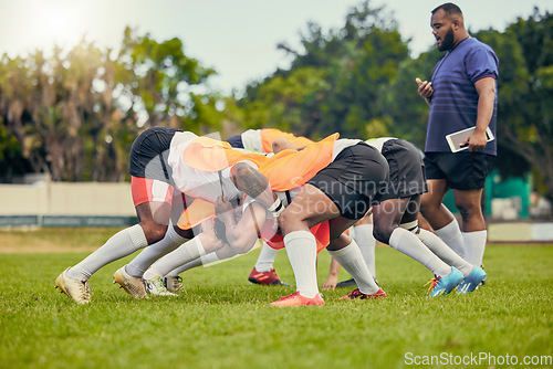 Image of Rugby, scrum or men training with coach on grass field ready for match, practice or sports game. Fitness, performance or strong athletes in tackle for warm up, exercise and workout for a competition