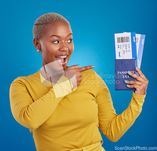 Image of Travel passport, happy and black woman point in studio on blue background with flight documents, tickets and ID. Traveling mockup, tourism and girl for immigration, USA holiday and global vacation