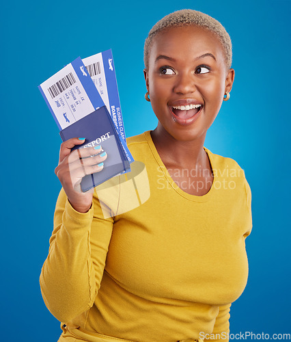 Image of Smile, travel passport and black woman in studio on blue background with flight documents, tickets and ID. Traveling mockup, happy and girl celebrate immigration, holiday and international vacation
