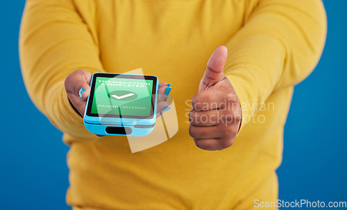 Image of Phone screen, transaction and person thumbs up for payment success in e commerce, online shopping and mobile app. Yes, like and thank you sign of woman with machine and fintech check mark in studio