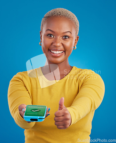 Image of Phone screen, payment and woman thumbs up for transaction success in e commerce, online shopping and mobile app. Yes, like and thank you sign of black person, machine and fintech check mark in studio