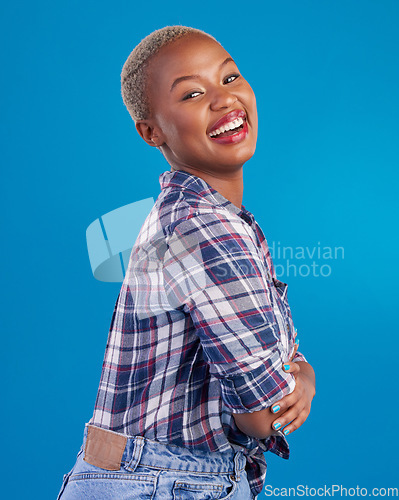 Image of Happy, smile and portrait of black woman with confidence, happiness and empowerment in studio. Fashion, beauty and girl model laughing on blue background with pride, positive mindset and motivation