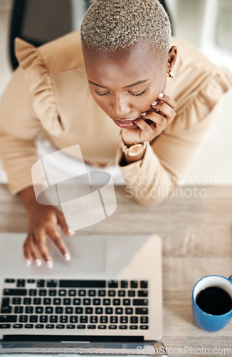 Image of Laptop, top view and African businesswoman working on. a corporate project with a cup of coffee. Technology, professional and female employee doing research for report on a computer in the workplace.