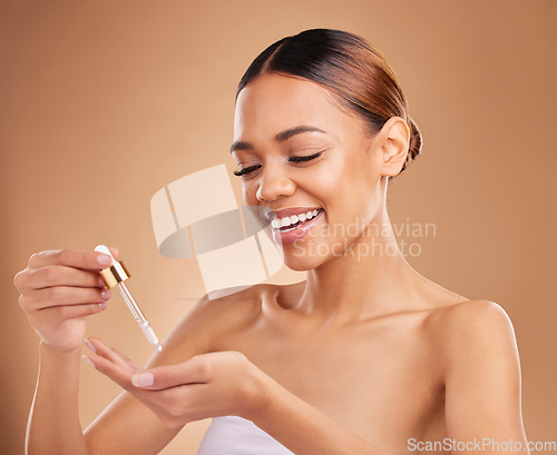 Image of Face oil, smile or happy woman in studio isolated on beige background for skincare hydration or beauty. Facial products, serum or funny natural girl laughing with glow or luxury self care cosmetics