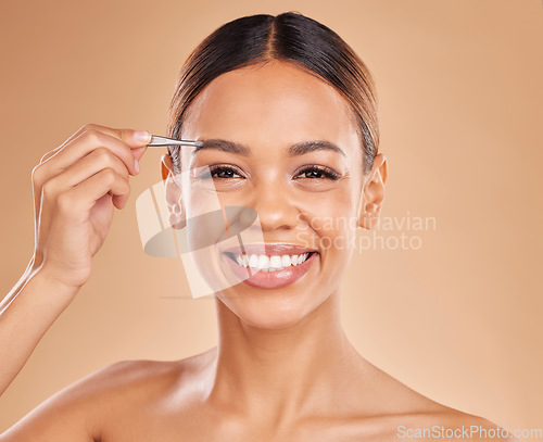 Image of Beauty, eyebrows and portrait of woman and tweezers in studio for clean, self care and cosmetics. Facial, plucking and shape with female model on brown background for hair removal and skincare