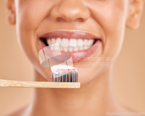 Image of Woman, teeth and big smile with toothbrush for dental care, hygiene or wellness against a studio background. Closeup of female mouth smiling with tooth paste for healthy or clean oral and gums