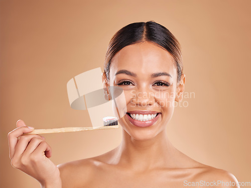 Image of Portrait, toothpaste or girl brushing teeth with product for healthy oral or dental hygiene in studio. Face model, smile beauty or happy woman cleaning mouth with a natural bamboo wooden toothbrush