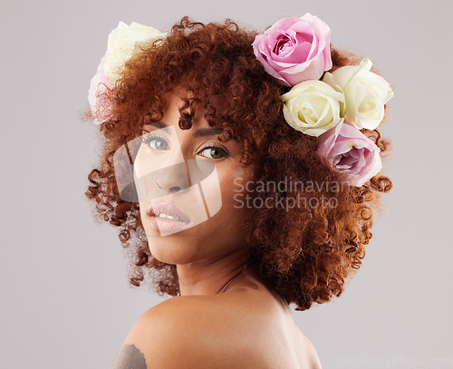 Image of Portrait, beauty and flowers with a model black woman in studio on a gray background for natural skincare. Wellness, luxury and face with an attractive young female wearing a flower crown or wreath