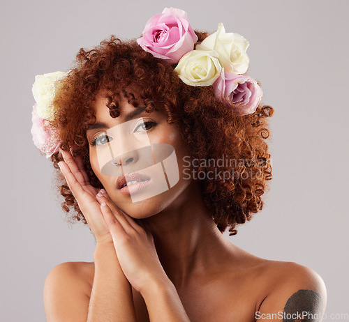 Image of Portrait, skincare and flowers with a model woman in studio on a gray background for natural beauty. Wellness, luxury and face with an attractive young female wearing a flower crown or wreath