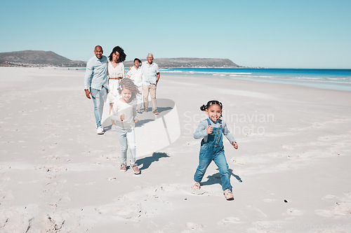 Image of Family, beach and happy kids running in sand, playful and having fun while bonding outdoors. Face, children and parents with grandparents on summer vacation at sea on ocean trip in South Africa