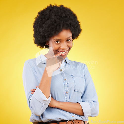 Image of Happy, flirting and portrait of a black woman in a studio with confidence, love and romance face. Happiness, smirk and African female model biting her finger for a sexy gesture by a yellow background