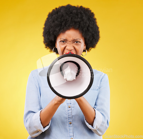 Image of Megaphone announcement, portrait or angry black woman protest for democracy vote, justice or human rights rally. Racism, microphone voice speech or justice speaker shout isolated on yellow background