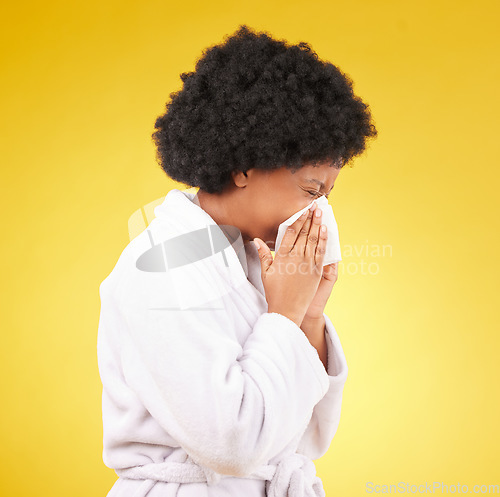 Image of Sick black woman, tissue and blowing nose with afro and morning gown against a studio background. Isolated African American female with cold, flu or symptoms for illness, covid or fever on mockup