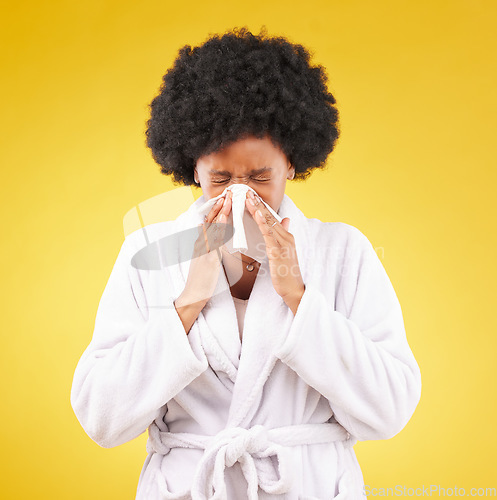 Image of Black woman, afro and sick blowing nose with tissue and morning gown against a studio background. Isolated African American female with cold, flu or symptoms for illness, covid or fever on mockup