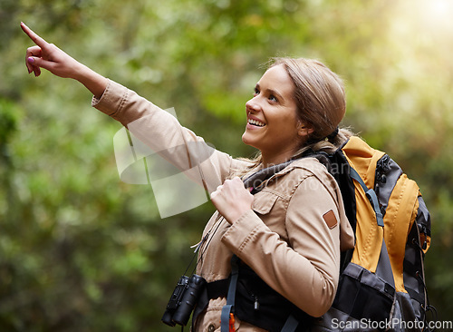 Image of Hiking, pointing or happy woman in nature, forest or wilderness for a trekking adventure. Freedom, backpack excited female hiker walking in a natural park or woods for exercise or wellness on holiday