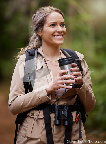 Image of Travel, forest and woman with coffee for hiking journey, jungle adventure and nature backpack and outdoor thinking. Happy camper or hiker person trekking or explore in rainforest or tropical woods