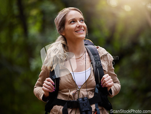 Image of Hiking, thinking and forest with a woman outdoor, walking in nature or the wilderness for adventure. Freedom, location and woods with an attractive young female hiker taking a walk in a natural park