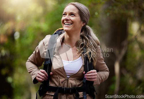 Image of Hiking, happy and woods with a woman outdoor, walking in nature or the wilderness for adventure. Freedom, location and forest with an attractive young female hiker taking a walk in a natural park