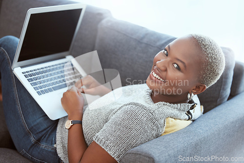 Image of Happy black woman, portrait and sofa with laptop mockup to search social media, online shopping or download. Female relax on couch with computer technology, mock up and internet blogging with smile