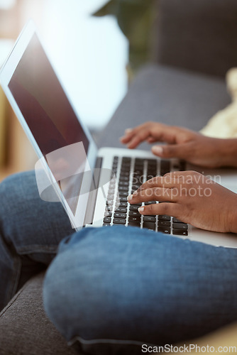 Image of Laptop, female and hands typing on a keyboard while working on a freelance project at her house. Technology, research and closeup of woman working on a report with a computer in living room at home.