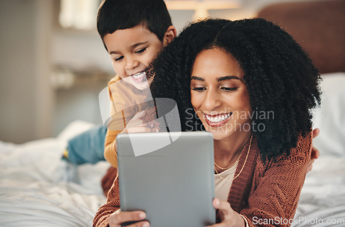 Image of Tablet, mother and kid smile on bed, bonding and streaming movie, film or video online. Technology, care and relax of happy mama with touchscreen for learning development with boy or child in bedroom