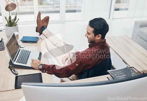 Image of Working from home man with feet up on desk reading news on laptop with job confidence, productivity and online career. Remote worker, entrepreneur or professional person relax and smiling on computer