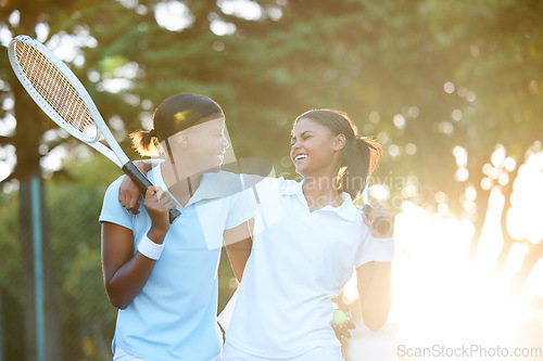 Image of Tennis, team and happiness with women outdoor, sun and lens flare, sports and fitness, collaboration and hug. Exercise, bonding and female laugh, athlete and workout with partnership and racket