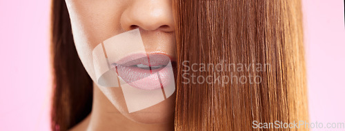 Image of Beauty, hair and mouth of black woman isolated in studio with pink background for salon advertising. Haircare, straightener and Brazilian hairstyle on model for luxury spa growth product promotion.