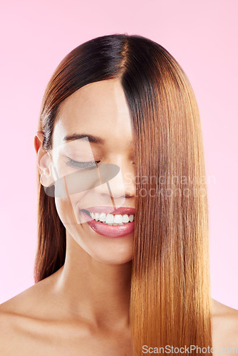 Image of Woman, beauty smile and hair in studio for salon, hairdresser or shine shampoo or treatment. Skincare and makeup glow or hairstyle of aesthetic model on a pink background for self care cosmetics