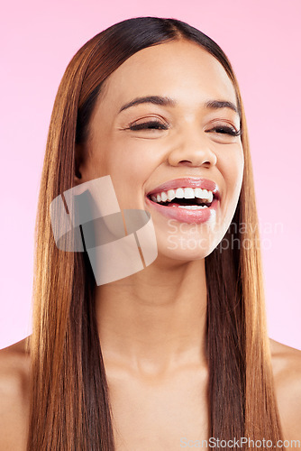 Image of Beauty cosmetics, hair and woman with a smile in studio for salon, hairdresser or shine. Skincare glow or hairstyle of aesthetic model person on a pink background laughing with self care skin bliss