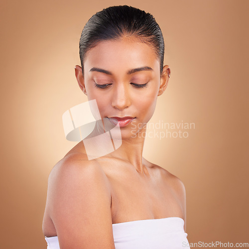 Image of Beauty, makeup and face of Indian woman for wellness, skincare glow and facial treatment in studio. Dermatology, luxury spa mockup and isolated serious girl with healthy skin, cosmetics and confident