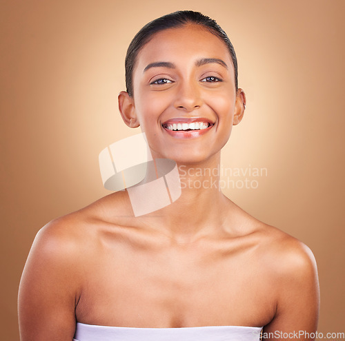 Image of Skincare, smile and portrait of Indian woman for beauty, healthy skin and facial treatment in studio. Dermatology, luxury spa and face of happy girl confident with makeup, cosmetics and wellness