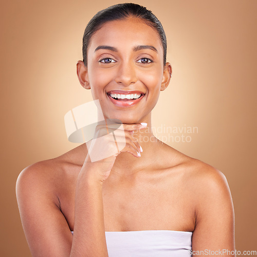 Image of Indian woman, skincare and studio portrait with smile for wellness, spa treatment and healthy by background. Girl, model and asian with cosmetics, happiness and natural glow on facial skin for health