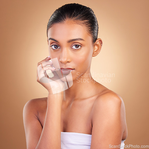 Image of Skincare, natural beauty and portrait of a woman in a studio for wellness and dermatology. Cosmetics, model and facial glow of a young person self care, makeup and healthy face shine from cosmetology