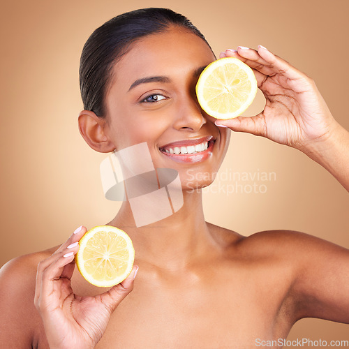 Image of Skincare smile, woman portrait and lemon for health, wellness and beauty of a young model with happiness. Studio and healthy fruit with vitamin c and fruits nutrition for facial and dermatology