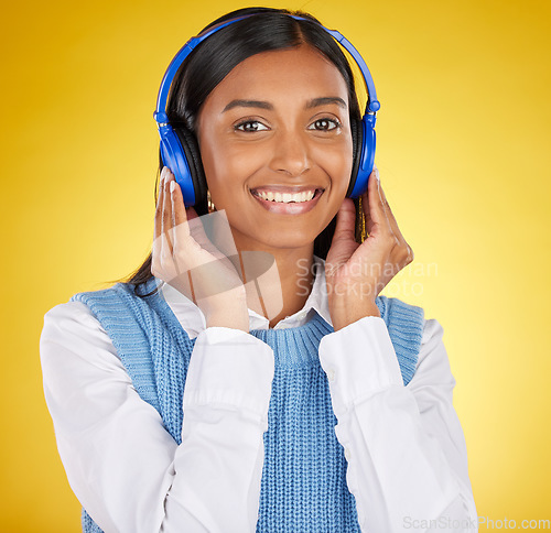 Image of Black woman, studio portrait and headphones for music, smile or happy for makeup, beauty and aesthetic by background. Gen z model, streaming and student with cosmetics, fashion and audio on internet