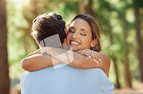 Image of Love, happy and forest couple hug on outdoor quality time together, hiking adventure or woods bonding journey. Peace, freedom and wilderness woman, man or romantic people embrace on nature date