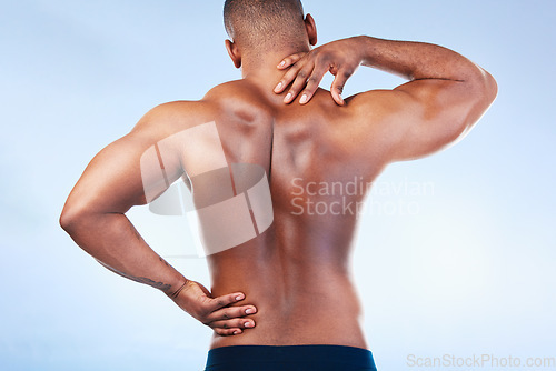 Image of Black man, neck pain and back injury with fitness and health, medical problem and aching body in studio. Emergency, muscle tension and male athlete with joint ache from workout on blue background