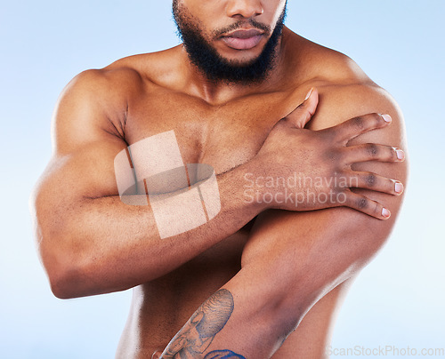 Image of Black man, shoulder pain and injury with fitness and health, medical problem and sore arms in studio. Emergency, muscle tension and male athlete with joint ache from workout on blue background