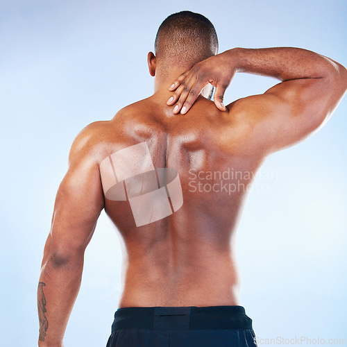 Image of Black man, neck pain and injury with exercise and health, medical problem and aching body with back view. Emergency, muscle tension and male athlete with joint ache from workout on blue background