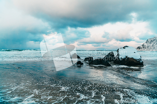 Image of Norway coast in winter with snow bad cloudy weather