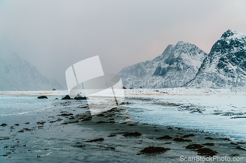 Image of Norway coast in winter with snow bad cloudy weather