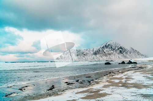 Image of Norway coast in winter with snow bad cloudy weather