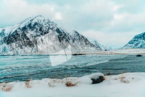 Image of Norway coast in winter with snow bad cloudy weather